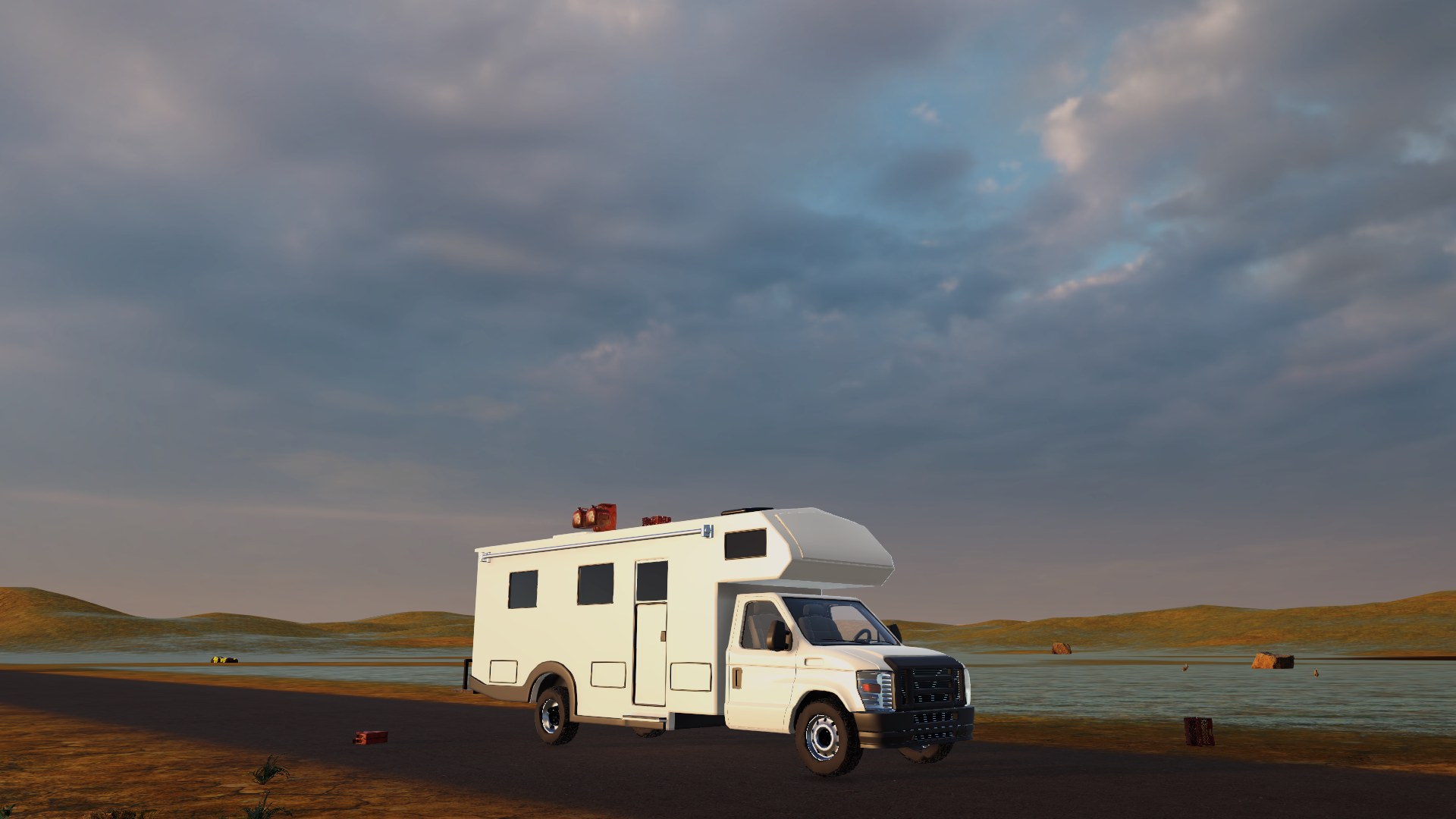 The white camper parked by a lake under a stormy evening sky